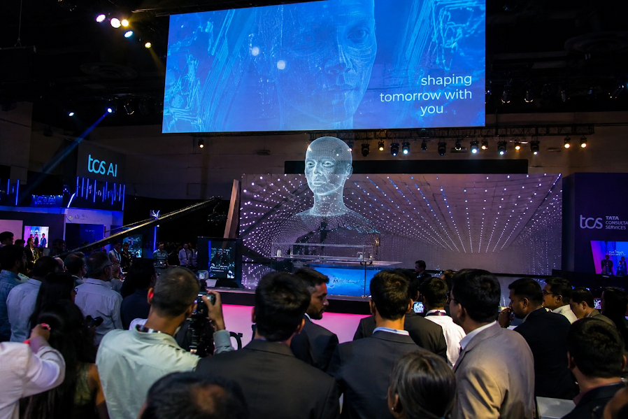 Futuristic tech event setup with immersive digital installations, AR VR experiences, hologram displays, interactive LED technology, and advanced event production for corporate events and brand activations